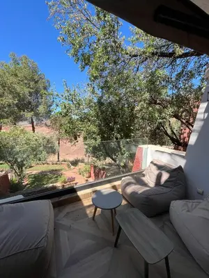 a living room with a couch and a table at Atlas AGUELMAM in Bine el Ouidane