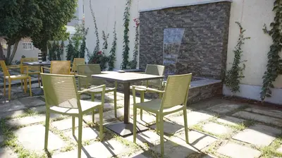 a group of chairs and a table and chairsitures at Hotel Riad Taounate in Taounate