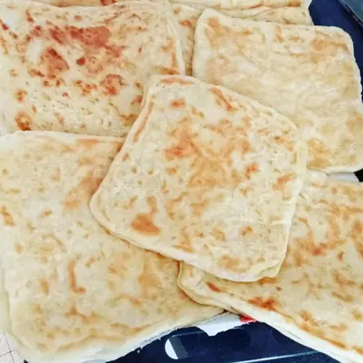 a pile of tortillas sitting on top of a table at holiday apartment rental in Meknès