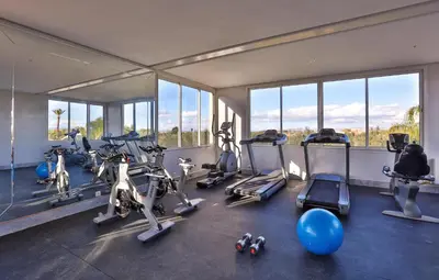 a gym with a bunch of exercise bikes in it at Palais Amador in Marrakech