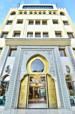 a building with a sign on the front of it at Fes Heritage Boutique luxury Hotel in Fès