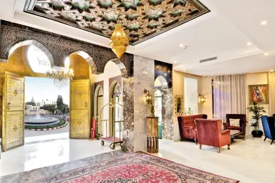 a lobby of a hotel with a rug and a ceiling at Fes Heritage Boutique luxury Hotel in Fès