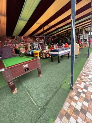 a store with a pool table in front of it at Villa privative tortues2 piscine chauffée 35min Marrakech in Marrakech