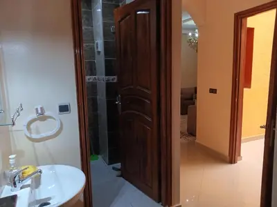 a bathroom with a shower and a sink at Résidence Jannat in Ouarzazate