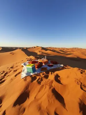an island in the middle of a desert at Luxury Camp Camelhouse in Merzouga