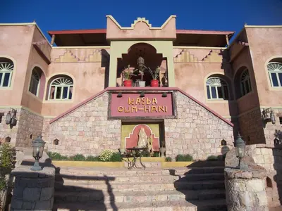 a building with a sign in front of it at Kasba Oum Hani d'Ouzoud in Ouzoud
