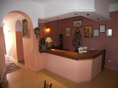a lobby with a counter in a room at Kasba Oum Hani d'Ouzoud in Ouzoud