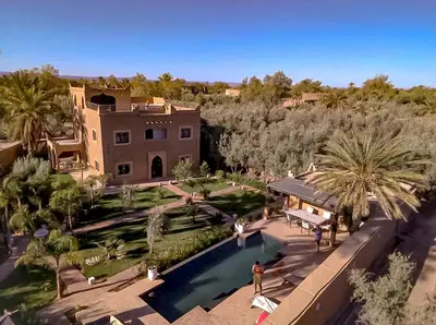 an aerial view of a house with a swimming pool at Dar Lily, villa familiale avec piscine et services in Skoura