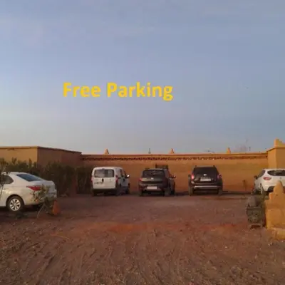 a group of cars parked in a parking lot at Luxury Desert Central Camp in Merzouga