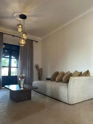 a living room with a couch and a table at Villa Beij in Marrakech