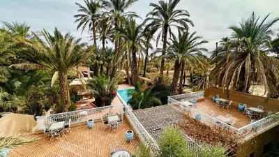an aerial view of a resort with palm trees at Chez Ali Zagora Authentic Hotel Restaurant and Desert Excursions in Zagora