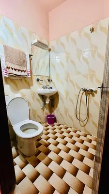 a bathroom with a toilet and a sink at Chez Ali Zagora Authentic Hotel Restaurant and Desert Excursions in Zagora