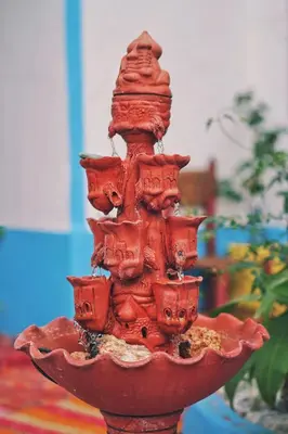 a red statue of a pirate ship on a table at Auberge Ayouze in Aït Ben Haddou
