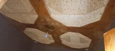 an overhead view of a wooden ceiling in a room at Auberge Amazigh in Tamtetoucht