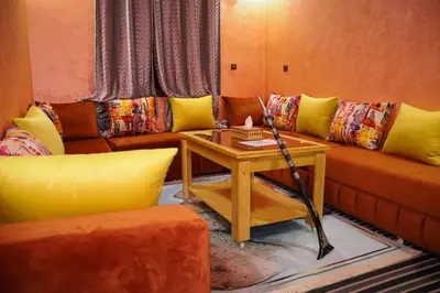 a living room with a couch and a table at DIAAFATE TANNIRTE in Khenifra