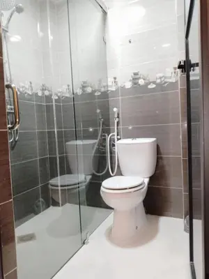 a bathroom with a toilet and a glass shower at DIAAFATE TANNIRTE in Khenifra