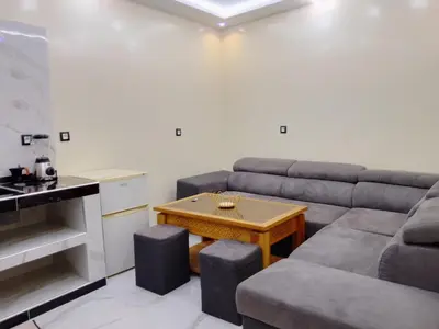 a living room with a couch and a table at DIAAFATE TANNIRTE in Khenifra