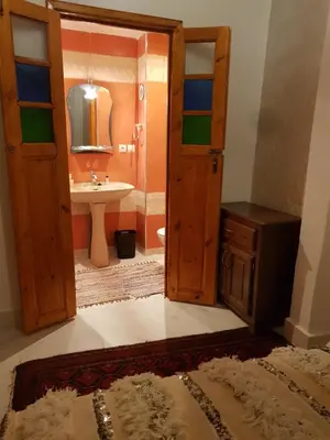 a bathroom with a sink and a mirror at DAR ALKATIB MEKNES in Meknès