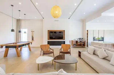 a living room with a ping pong table at Villa Safiya, luxe et détente, jeux, cuisinière in Marrakech