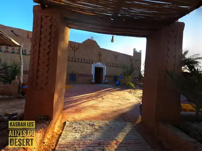 an entrance to a building in the desert at Kasbah Les Alizes Du Desert in Mhamid