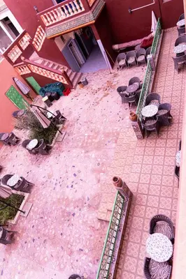 an overhead view of a patio with tables and chairs at HOTEL LA VALLEE DES KASBAHS CHEZ ILYAS in Tinerhir