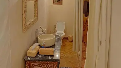 a bathroom with a sink and a toilet in a room at Sinbad luxury camp in Merzouga