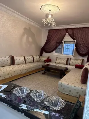 a living room with a couch and a table at NADIA BELVUE 3 in Meknès