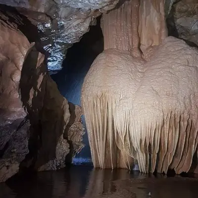 a cave with some ice formations in the water at Houcine gite in Taza