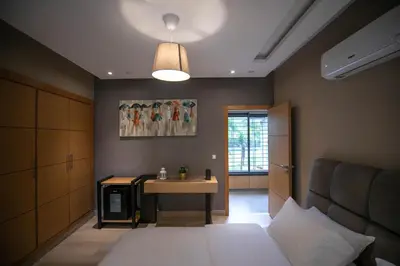 a bedroom with a bed and a table in it at Riad Bella Montana in Fès