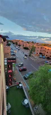 an aerial view of a parking lot in a city at Residence Imlil Ouarzazate in Ouarzazate