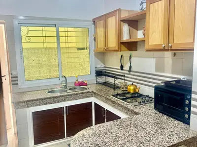 a kitchen with a sink and a window at A appartement in Fès