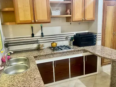 a kitchen with a sink and a counter top at A appartement in Fès