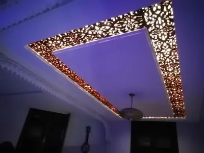 a mirror with lights on the ceiling of a room at Appart Artisanal sur Fez in Fès