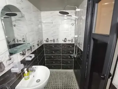 a bathroom with a sink and a toilet and a shower at Appart Artisanal sur Fez in Fès