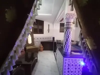 a view of a living room with purple lighting at Appart Artisanal sur Fez in Fès