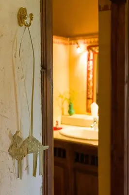 a bathroom with a sink and a mirror at Auberge Ksar Jallal in Ksar Oled Cherki