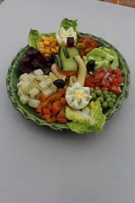 a plate of food with vegetables on a table at Kasbah of Peace Draa Valley Zagora in Zagora