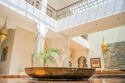 a fountain in the lobby of a building at Al Destino Villa Riad Spa Luxury Marrakech in Marrakech