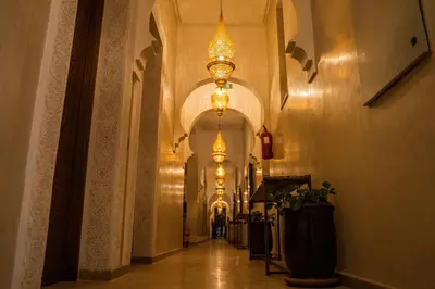 a hallway of a building with chandeliers at Al Destino Villa Riad Spa Luxury Marrakech in Marrakech