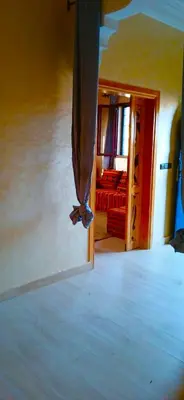 a view of a bedroom with a bed and a window at Dar Amrad in Merzouga