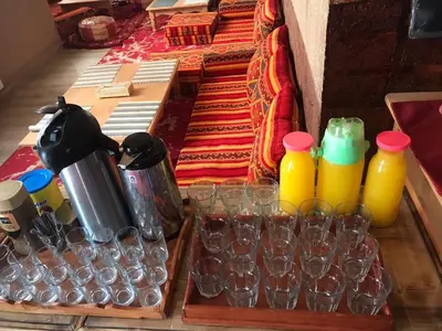 a group of glasses and bottles and cups on a table at DAR AL QANASS IMANE in Midelt