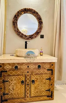a bathroom with a sink and a mirror at Tranquility Luxury Camp in Merzouga