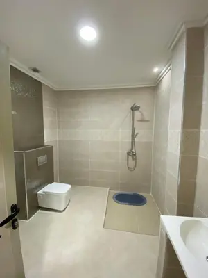 a bathroom with a shower and a toilet and a sink at Le ruban d’or in Azilal