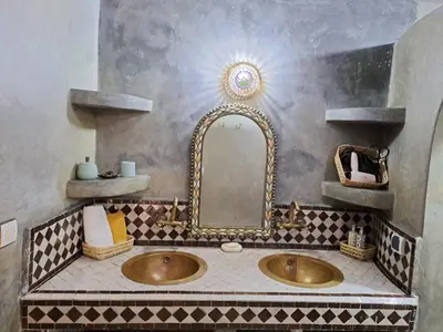 a bathroom with a sink and a mirror at Dar S'BAH in Fès