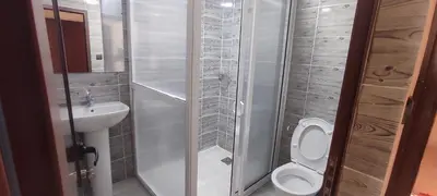 a small bathroom with a toilet and a sink at Maison d'Hôtes Ghalil in Ouarzazate
