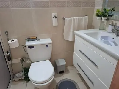 a bathroom with a white toilet and a sink at Tranquil Oasis in the Heart of Ifrane in Ifrane