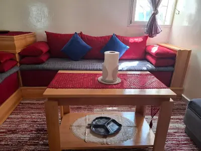 a living room with a couch and a table at Tranquil Oasis in the Heart of Ifrane in Ifrane