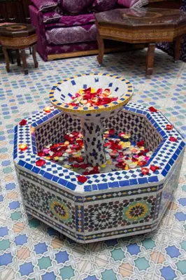 a table sitting on top of a table in a room at Riad Baba in Fès