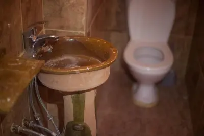 a bathroom with a sink and a toilet at Kasbah Ait Kassi in Boumalne