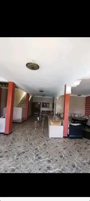 a living room with two beds and a couch at Villa Baraka in Marrakech